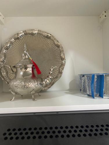 a silver tea pot sitting on a shelf at High Standing & cozy apartment in central Casablanca in Casablanca