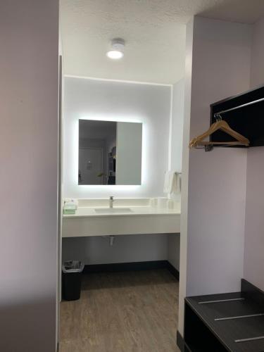 a bathroom with a sink and a mirror at Motel 6-Ogden, UT - 21st Street in Ogden