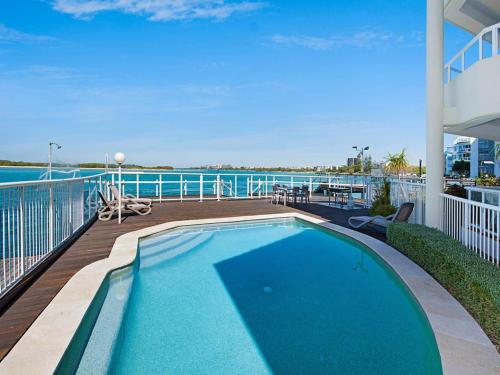 a swimming pool on the deck of a cruise ship at Pumicestone Quays by Luxury Escapes Caloundra in Caloundra