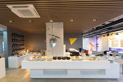 a bakery with a buffet of food on display at Aiden by Best Western Cheongdam in Seoul