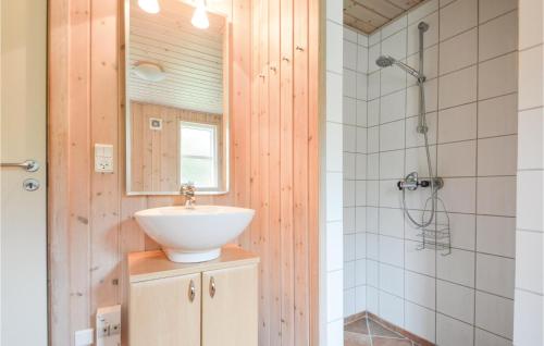 a bathroom with a sink and a shower at Lovely Home In Rm With Kitchen in Bolilmark