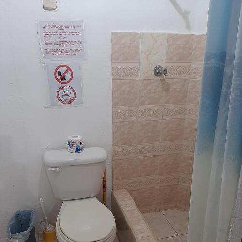 a bathroom with a toilet and a shower at B&B KeisyAlba Punta Rucia in Punta Rucia