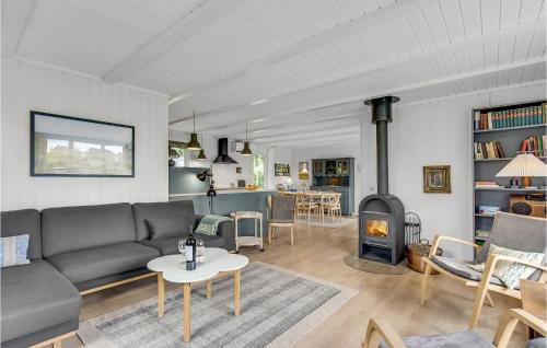 a living room with a couch and a fireplace at Gorgeous Home In Børkop With Kitchen in Børkop