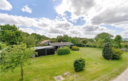 an aerial view of a house with a yard at Gorgeous Home In Farsø With Kitchen in Farsø
