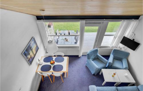 an overhead view of a living room with chairs and a table at Holiday Home Nørrevang Væggerløse Iv in Marielyst