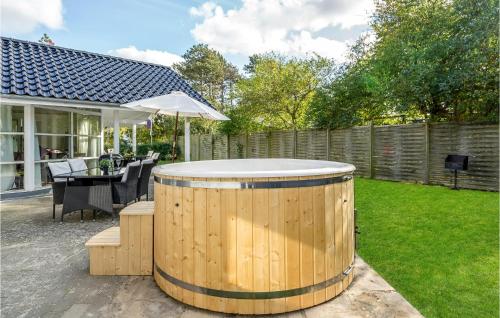 a hot tub in the backyard of a house at Cozy Home In Slagelse With Kitchen in Slagelse