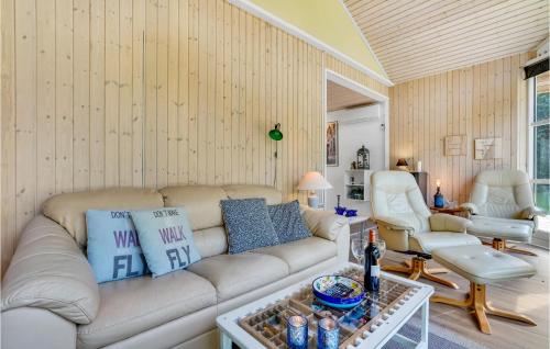 a living room with a couch and a table at 3 Bedroom Beautiful Home In Vig in Vig