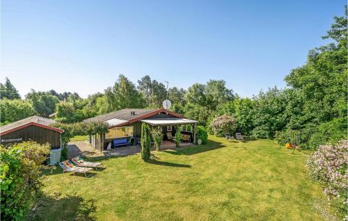 a yard with a pavilion and a house at Three-Bedroom Holiday Home In Rodby in Rødby
