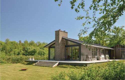 a brick house with a chimney on the side of it at Three-Bedroom Holiday Home In Skals in Skals