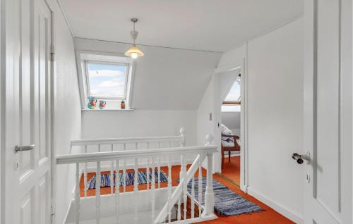 a white room with a staircase and a window at Stunning Home In Tranekær With Wifi in Tranekær