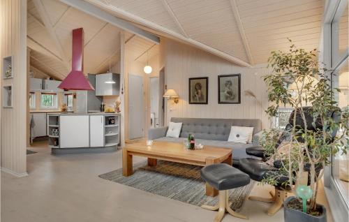 a living room with a couch and a table at 2 Bedroom Amazing Home In Slagelse in Slagelse