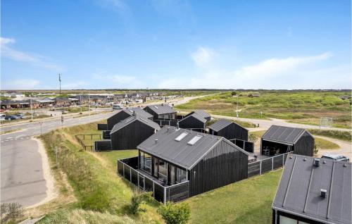 an overhead view of a house with black roofs at Holiday Home Lakolk Denmark Iii in Rømø