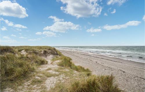 a sandy beach with a view of the ocean at Amazing Home In Anholt With Kitchen in Anholt