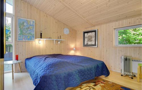 A bed or beds in a room at Stunning Home In Vggerlse With 3 Bedrooms, Sauna And Wifi