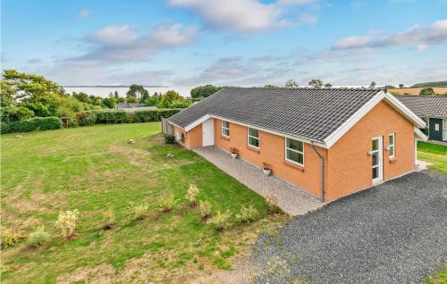 an overhead view of a house with a yard at Beautiful Home In Faaborg With Sauna in Fåborg