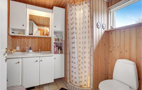 a bathroom with a toilet and a sink and a shower at 3 Bedroom Beautiful Home In Struer in Struer