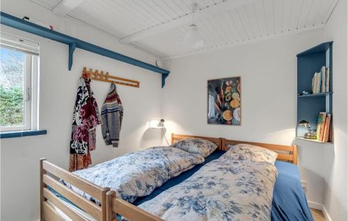 a bedroom with two beds and a window at 3 Bedroom Beautiful Home In Struer in Struer