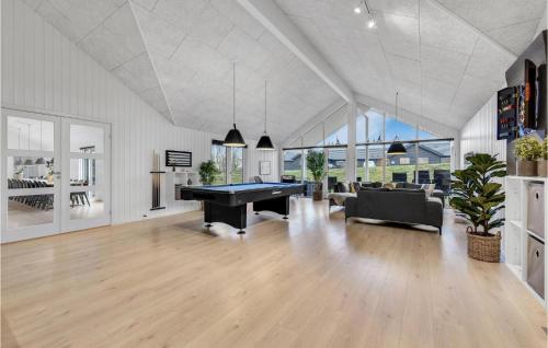 a large living room with a pool table in it at Nice Home In Sydals With Sauna in Sarup