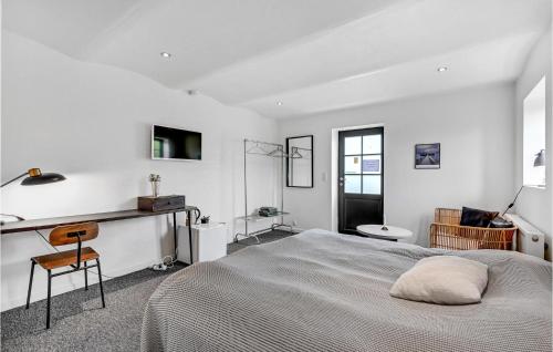 a bedroom with a bed and a desk and a sink at Amazing Home In Engesvang in Engesvang