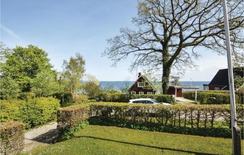 a garden with a fence and a house at Three-Bedroom Holiday Home In Haderslev in Haderslev