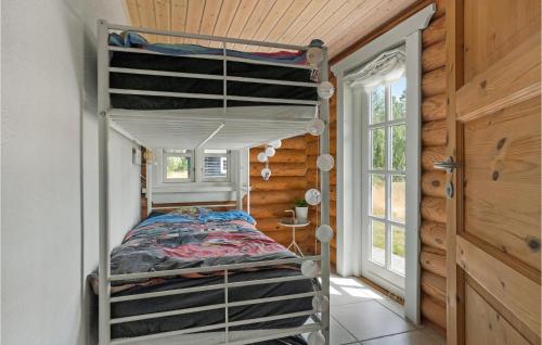 a bedroom with a bunk bed in a tiny house at Nice Home In Grlev With House Sea View in Gørlev