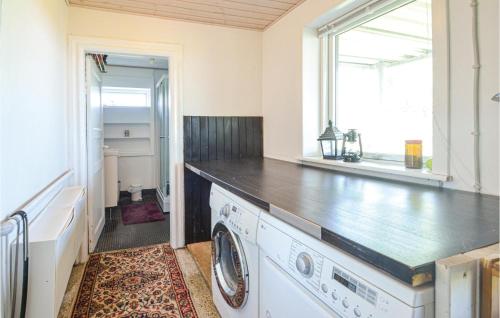 a laundry room with a washer and dryer at Three-Bedroom Holiday Home In Vinderup in Vinderup