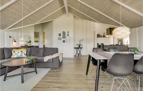 a living room with a couch and a table at 3 Bedroom Cozy Home In Sydals in Sarup