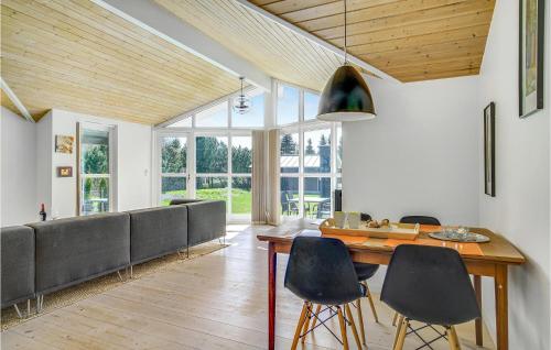 a living room with a table and chairs at Beautiful Home In Kalundborg With Wifi in Kalundborg