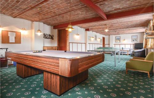 a billiard room with a pool table and a table at Foldingbro Kro in Lintrup