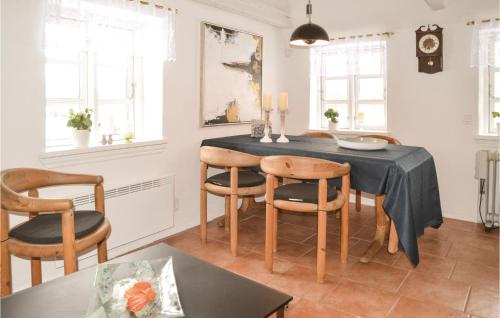 a dining room with a table and chairs at Three-Bedroom Holiday Home In Give in Give