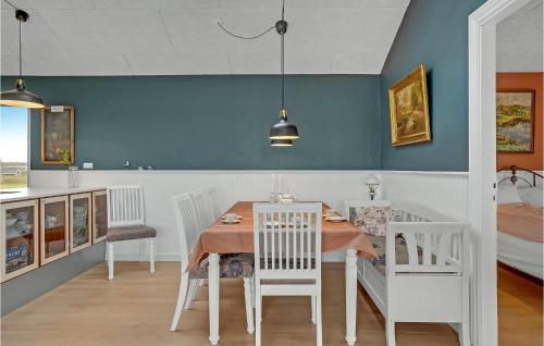 a dining room with a table and chairs at Beautiful Home In Haderslev With Sauna in Haderslev