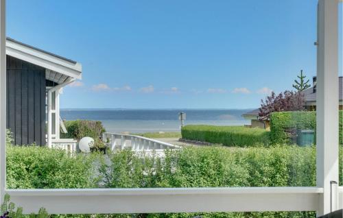 a view of the ocean from a house at Three-Bedroom Holiday Home In Bjert in Binderup Strand