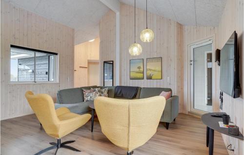 a living room with a couch and a table at Awesome Home In Sydals With Sauna in Sarup