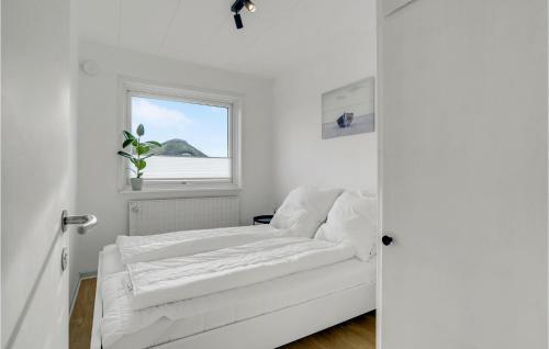 a white room with a couch and a window at Stunning Home In Hvide Sande With Kitchen in Hvide Sande