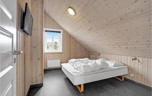 a bedroom with a white bed in a attic at Gorgeous Home In Skjern With Kitchen in Skjern