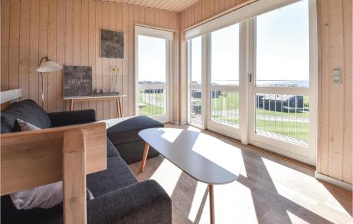 a living room with a couch and a table at Mosegården in Fåborg