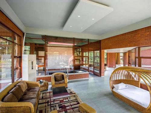 a large living room with a couch at Sarah Resort Gazipur in Rājābāri
