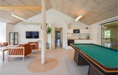 a living room with a pool table at Eight-Bedroom Holiday Home In Glesborg in Glesborg