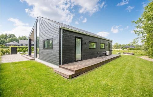 a small black house with a large backyard at Lovely Home In Toftlund With Wifi in Toftlund