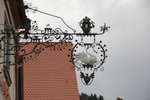 a building with a chandelier and a roof at Hotel Restaurant Schwan in Wertheim