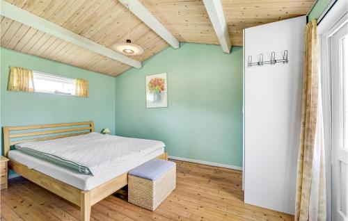 a bedroom with a bed and a wooden ceiling at Cozy Home In Slagelse With Kitchen in Slagelse