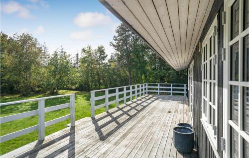 a porch of a house with a white fence at Gorgeous Home In Vejby With Wifi in Vejby