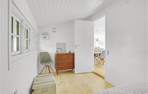 a bedroom with a bed and a desk and a chair at Gorgeous Home In Vejby With Wifi in Vejby
