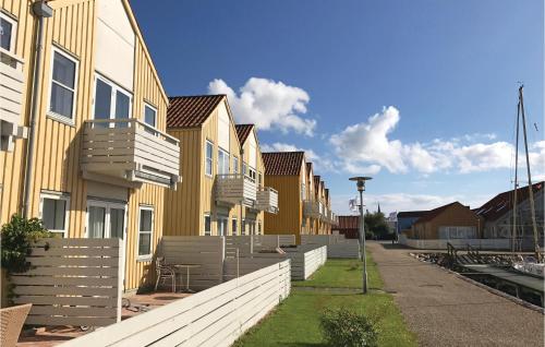 a row of houses on the side of a street at Two-Bedroom Apartment In Rudkobing in Rudkøbing