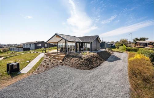 a house on a hill with a house at Beautiful Home In Hejls With Wifi in Hejls