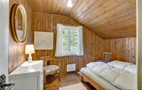 a bedroom with a bed and a window at Strandly in Kelstrup Strand