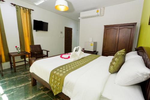 Postel nebo postele na pokoji v ubytování The Mouth Resort - SHA Extra Plus
