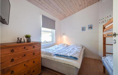 a bedroom with a bed and a dresser and a window at Beautiful Home In Bjert With Wifi in Sønder Bjert