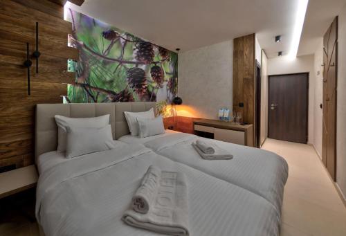 Ένα ή περισσότερα κρεβάτια σε δωμάτιο στο Bijele Vode spa&nature hotel