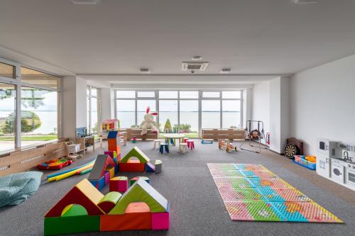 a room with a play area with toys in it at Hotel Glamour in Kaluža